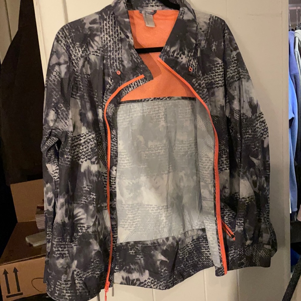 Lightly worn light weight rain jacket. Size large